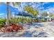 Community lounge area with striped cabanas and chairs at 4716 Foxtail Dr, Parrish, FL 34219