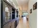 Hallway with built-in storage and view into dining area at 4716 Foxtail Dr, Parrish, FL 34219
