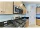 Stainless steel appliances and granite countertops highlight this kitchen at 4716 Foxtail Dr, Parrish, FL 34219