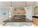 Kitchen features granite countertops and a spacious island with seating at 4716 Foxtail Dr, Parrish, FL 34219