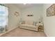 Relaxing sitting room with a comfy sofa and coastal decor at 4716 Foxtail Dr, Parrish, FL 34219