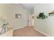 Light and airy sitting room with sofa and access to hallway at 4716 Foxtail Dr, Parrish, FL 34219