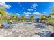 Community spa with lounge chairs and a paved patio at 4716 Foxtail Dr, Parrish, FL 34219