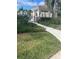 Landscaped walkway leading to community pool at 4882 Maymont Park Cir, Bradenton, FL 34203