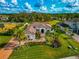Luxury home with a large lot, landscaping, and palm trees at 4986 Antiquity Way, Sarasota, FL 34240