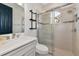 Clean bathroom with a walk-in shower, toilet and vanity at 4986 Antiquity Way, Sarasota, FL 34240