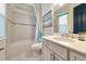 Clean bathroom with shower/tub combo, vanity, and updated fixtures at 4986 Antiquity Way, Sarasota, FL 34240