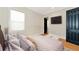 Serene bedroom with a queen bed, neutral decor, and a view at 4986 Antiquity Way, Sarasota, FL 34240