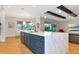 Open-concept kitchen with an island and a view of the backyard at 4986 Antiquity Way, Sarasota, FL 34240