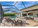 Relaxing pool area with lounge chairs and covered patio at 4986 Antiquity Way, Sarasota, FL 34240