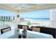 Oceanfront balcony with patio furniture, perfect for dining at 5830 Midnight Pass Rd # 502, Sarasota, FL 34242