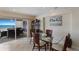 Bright dining room with glass table and ocean view at 5830 Midnight Pass Rd # 502, Sarasota, FL 34242