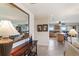 Entryway with mirror reflecting living room and kitchen at 5830 Midnight Pass Rd # 502, Sarasota, FL 34242