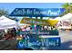Siesta Key Farmers Market sign with various food options at 5830 Midnight Pass Rd # 502, Sarasota, FL 34242