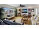 Bright living room with comfortable seating and large TV at 5830 Midnight Pass Rd # 502, Sarasota, FL 34242