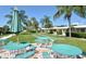 Community patio with shuffleboard and picnic tables at 5830 Midnight Pass Rd # 502, Sarasota, FL 34242