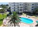 Inviting community pool with lounge chairs, ideal for relaxation at 5830 Midnight Pass Rd # 502, Sarasota, FL 34242