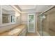 Bathroom with vanity, tub, and shower at 605 Wild Turkey Ln, Sarasota, FL 34236