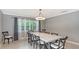 Dining room with marble table and six chairs at 605 Wild Turkey Ln, Sarasota, FL 34236