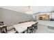 Spacious dining room with marble table and kitchen views at 605 Wild Turkey Ln, Sarasota, FL 34236