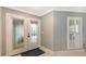 Bright entryway with double doors and white shutters at 605 Wild Turkey Ln, Sarasota, FL 34236
