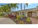 House exterior showcasing landscaping and a brick walkway at 605 Wild Turkey Ln, Sarasota, FL 34236