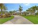 Landscaped property with a long driveway leading to a house at 605 Wild Turkey Ln, Sarasota, FL 34236