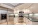 Modern kitchen with stainless steel appliances and granite countertops at 605 Wild Turkey Ln, Sarasota, FL 34236