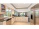 Kitchen features granite counters, stainless steel appliances, and breakfast bar at 605 Wild Turkey Ln, Sarasota, FL 34236