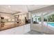 Kitchen with granite counters, stainless steel appliances, and pool view at 605 Wild Turkey Ln, Sarasota, FL 34236