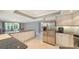 Spacious kitchen with island, stainless steel appliances, and granite counters at 605 Wild Turkey Ln, Sarasota, FL 34236