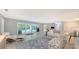 Living room with pool view and comfortable seating at 605 Wild Turkey Ln, Sarasota, FL 34236