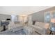 Living room with large windows and access to the pool at 605 Wild Turkey Ln, Sarasota, FL 34236
