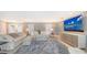 Living area featuring a large TV and comfortable seating at 605 Wild Turkey Ln, Sarasota, FL 34236