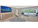 Living room with large screen TV and pool view at 605 Wild Turkey Ln, Sarasota, FL 34236
