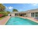 Refreshing pool area with covered lanai and comfortable seating at 605 Wild Turkey Ln, Sarasota, FL 34236
