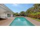 Refreshing pool with patio and lush landscaping at 605 Wild Turkey Ln, Sarasota, FL 34236