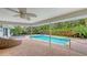 Inviting pool area with covered patio and lounge chairs at 605 Wild Turkey Ln, Sarasota, FL 34236