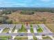 Aerial view of a house and neighborhood with a lot of green space at 6609 114Th E Ave, Parrish, FL 34219
