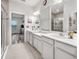Elegant bathroom featuring a double vanity and a large mirror at 6609 114Th E Ave, Parrish, FL 34219