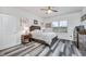 Cozy bedroom with double bed, wooden dresser, and ceiling fan at 6609 114Th E Ave, Parrish, FL 34219