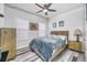 Bedroom with wood-look flooring and ceiling fan at 6609 114Th E Ave, Parrish, FL 34219