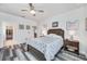 Bright bedroom with double bed, walk-in closet, and ceiling fan at 6609 114Th E Ave, Parrish, FL 34219