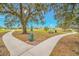 Curving concrete path with benches and trees at 6609 114Th E Ave, Parrish, FL 34219
