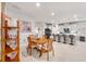 Bright dining area with wooden table and chairs, adjacent to the kitchen at 6609 114Th E Ave, Parrish, FL 34219