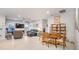 Open concept dining area with wooden table and chairs, near living room at 6609 114Th E Ave, Parrish, FL 34219