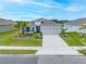Single-story home with gray siding, blue shutters, and landscaping at 6609 114Th E Ave, Parrish, FL 34219