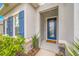 Front entry with blue door and stone accents at 6609 114Th E Ave, Parrish, FL 34219