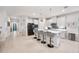 Modern kitchen with island, stainless steel appliances, and white cabinets at 6609 114Th E Ave, Parrish, FL 34219