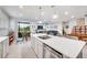 Open concept kitchen with large island, stainless steel appliances, and white cabinetry at 6609 114Th E Ave, Parrish, FL 34219
